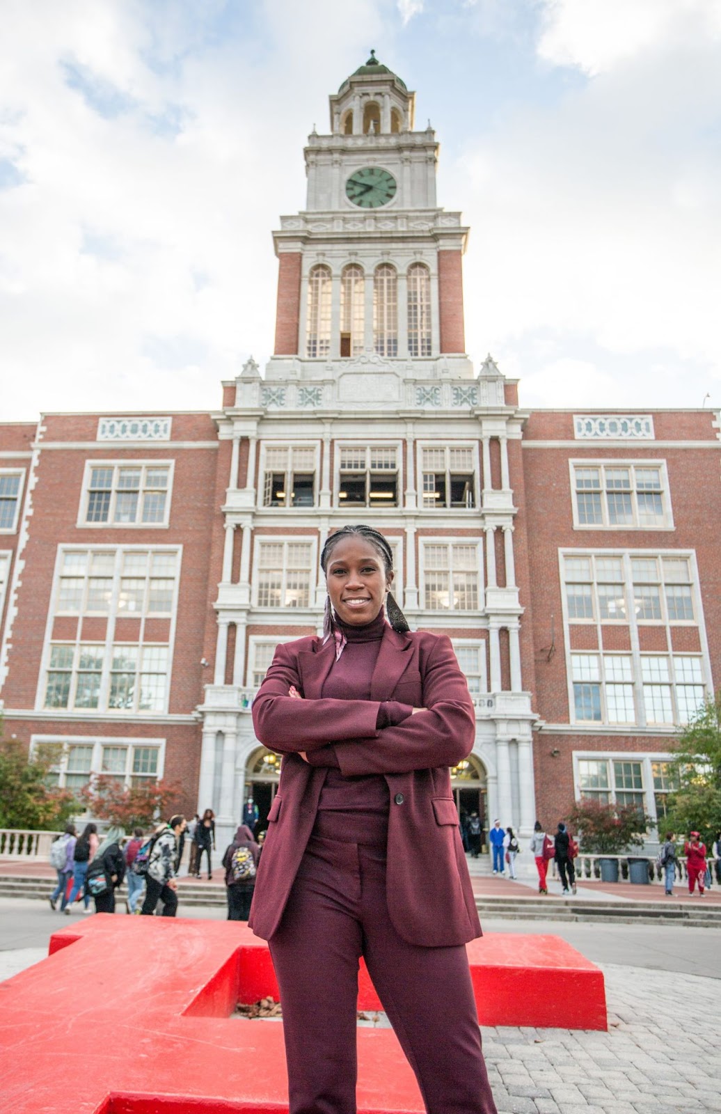 Principal Walker posing in front of East High School